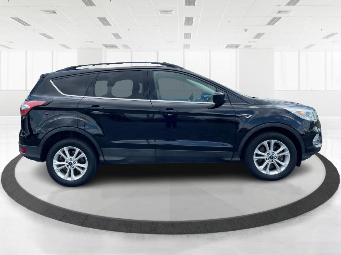 2017 Shadow Black Ford Escape SE 4WD (1FMCU9GD9HU) with an 1.5L L4 DOHC 16V engine, 6A transmission, located at 1230 East Main St, Xenia, OH, 45385, (937) 908-9800, 39.687321, -83.910294 - Photo#1