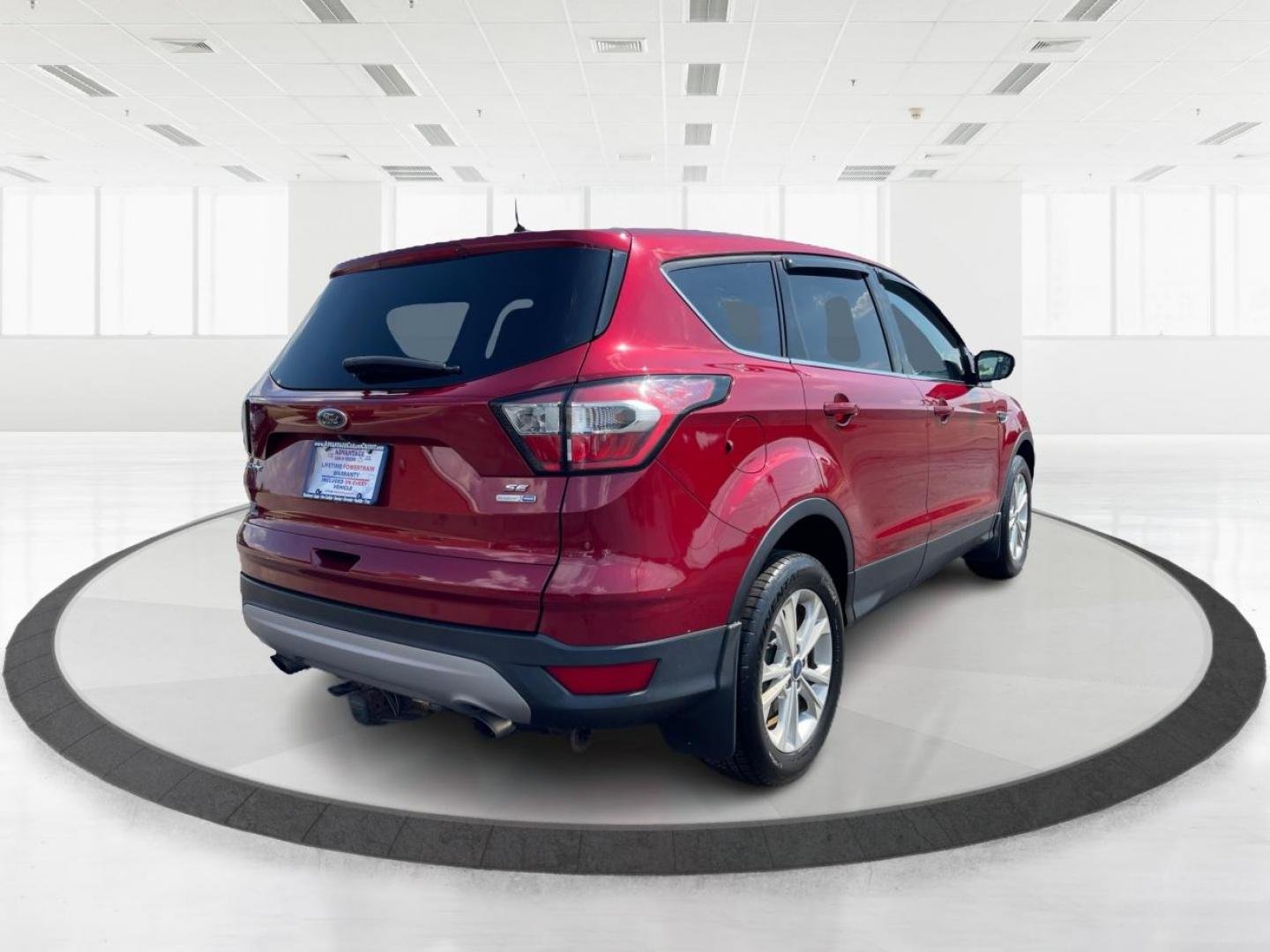 2017 Ruby Red Metallic Tinted Clearcoat Ford Escape (1FMCU9GD0HU) with an 1.5L L4 DOHC 16V engine, 6-Speed Automatic transmission, located at 880 E. National Road, Vandalia, OH, 45377, (937) 908-9800, 39.892189, -84.181015 - Photo#2