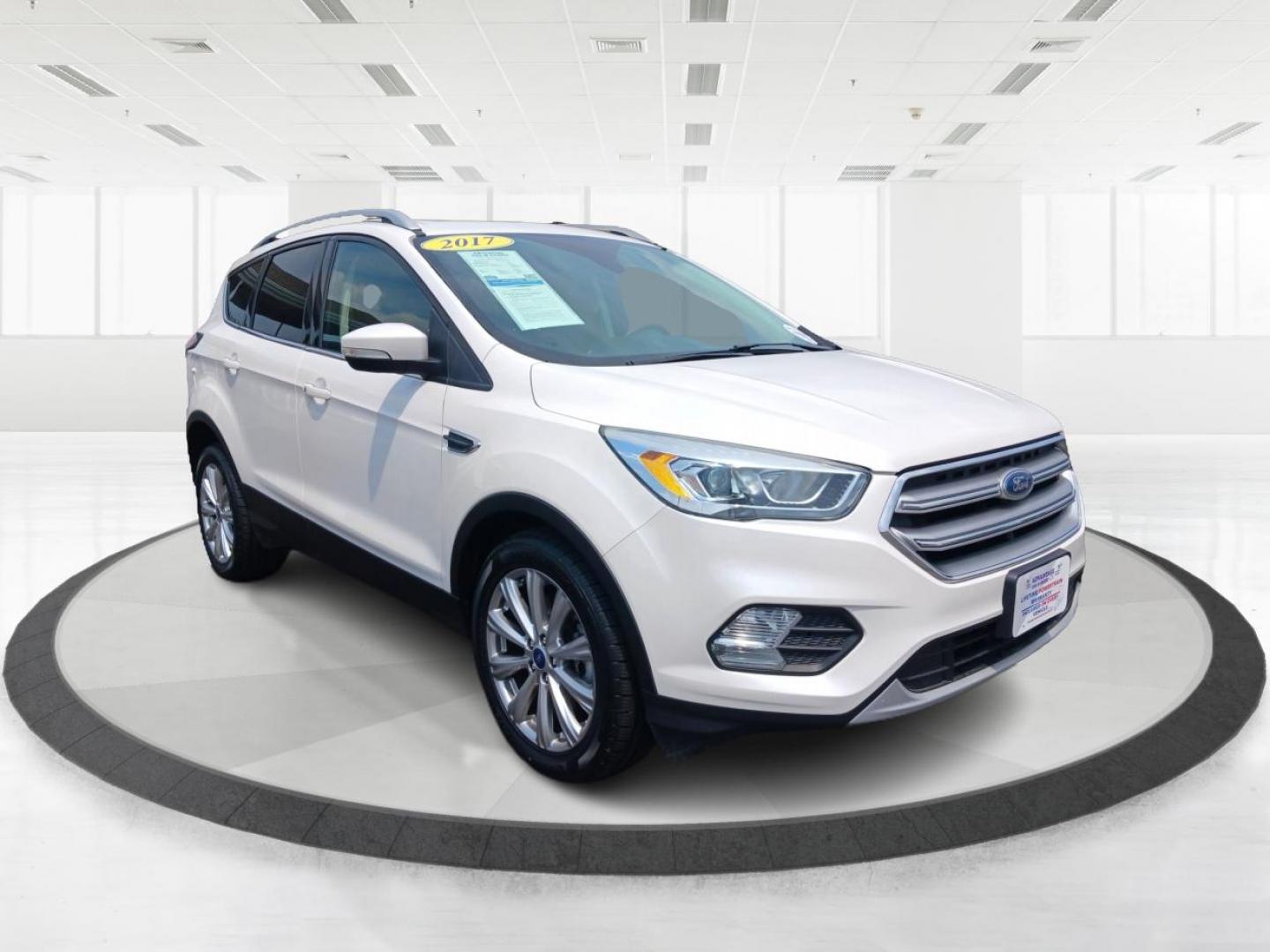 2017 White Gold Metallic Ford Escape (1FMCU9J96HU) with an 2.0L L4 DOHC 16V engine, 6-Speed Automatic transmission, located at 1099 N County Rd 25A, OH, 45373, (937) 908-9800, 40.057079, -84.212883 - Photo#0