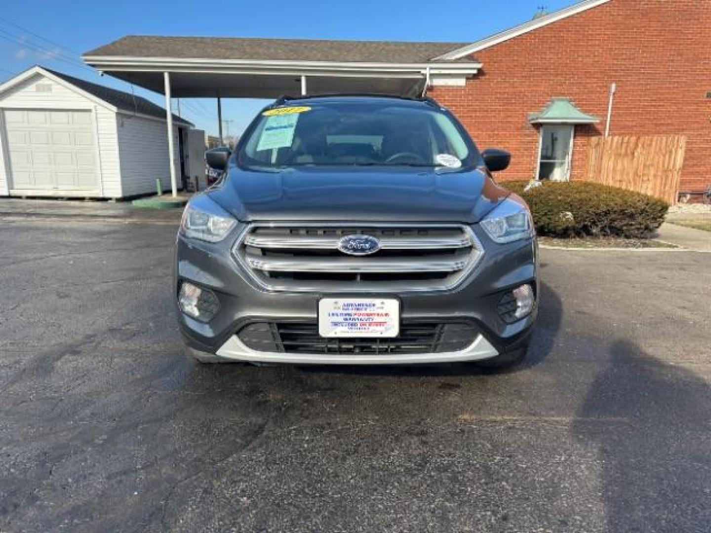 2017 Magnetic Metallic Ford Escape SE 4WD (1FMCU9G91HU) with an 2.0L L4 DOHC 16V engine, 6-Speed Automatic transmission, located at 1099 N County Rd 25A, OH, 45373, (937) 908-9800, 40.057079, -84.212883 - Photo#1