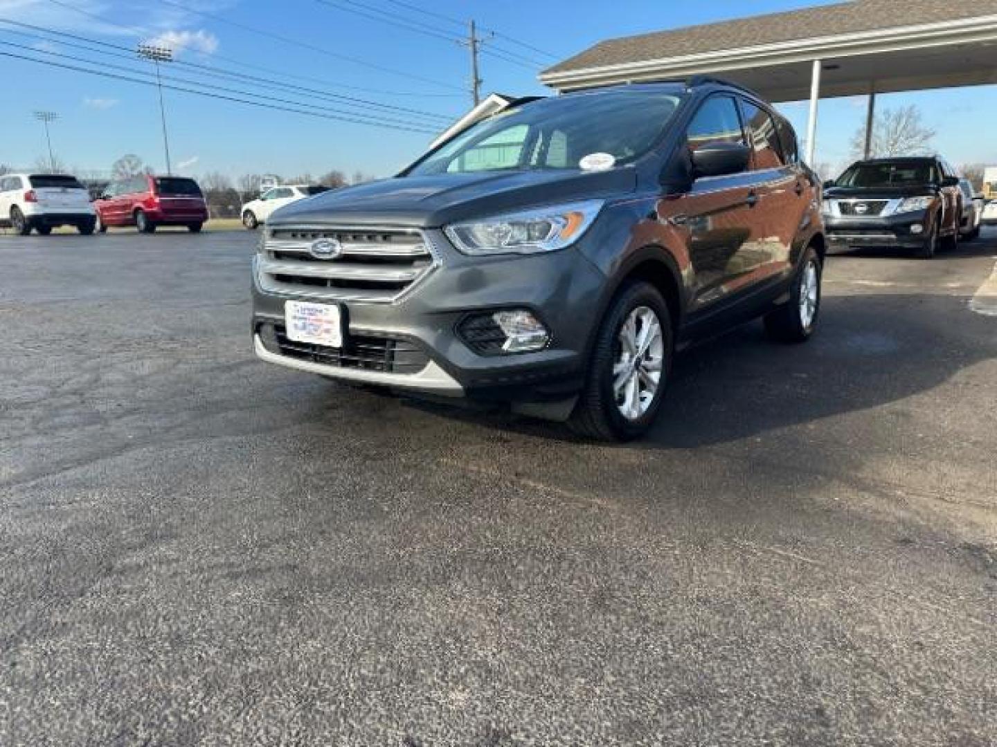 2017 Magnetic Metallic Ford Escape SE 4WD (1FMCU9G91HU) with an 2.0L L4 DOHC 16V engine, 6-Speed Automatic transmission, located at 1099 N County Rd 25A, OH, 45373, (937) 908-9800, 40.057079, -84.212883 - Photo#2