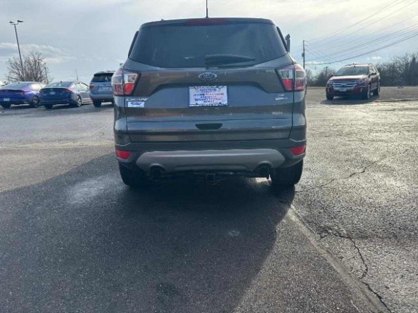 2017 Magnetic Metallic Ford Escape SE 4WD (1FMCU9G91HU) with an 2.0L L4 DOHC 16V engine, 6-Speed Automatic transmission, located at 1099 N County Rd 25A, OH, 45373, (937) 908-9800, 40.057079, -84.212883 - Photo#4