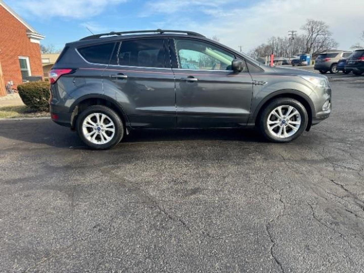 2017 Magnetic Metallic Ford Escape SE 4WD (1FMCU9G91HU) with an 2.0L L4 DOHC 16V engine, 6-Speed Automatic transmission, located at 1099 N County Rd 25A, OH, 45373, (937) 908-9800, 40.057079, -84.212883 - Photo#5