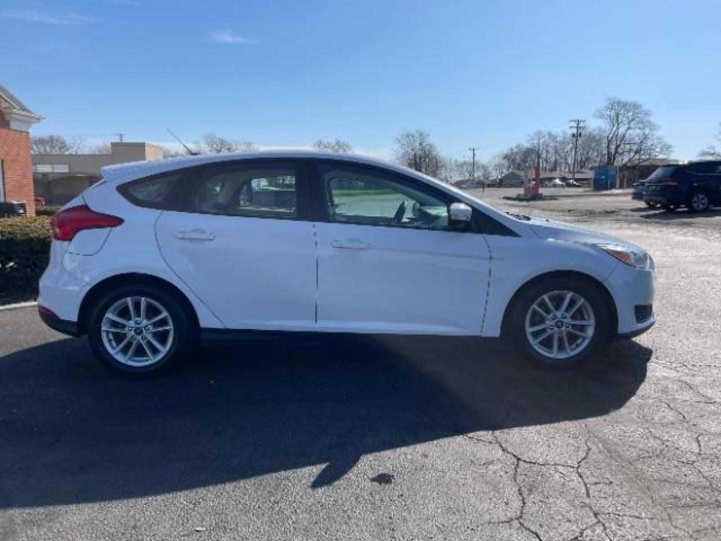 2017 Oxford White Ford Focus SE Hatch (1FADP3K22HL) with an 2.0L L4 DOHC 16V engine, located at 1099 N County Rd 25A, OH, 45373, (937) 908-9800, 40.057079, -84.212883 - Photo#5