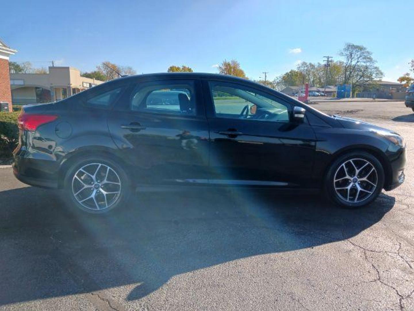 2017 Shadow Black Ford Focus SEL Sedan (1FADP3H2XHL) with an 2.0L L4 DOHC 16V engine, located at 4508 South Dixie Dr, Moraine, OH, 45439, (937) 908-9800, 39.690136, -84.216438 - Photo#4