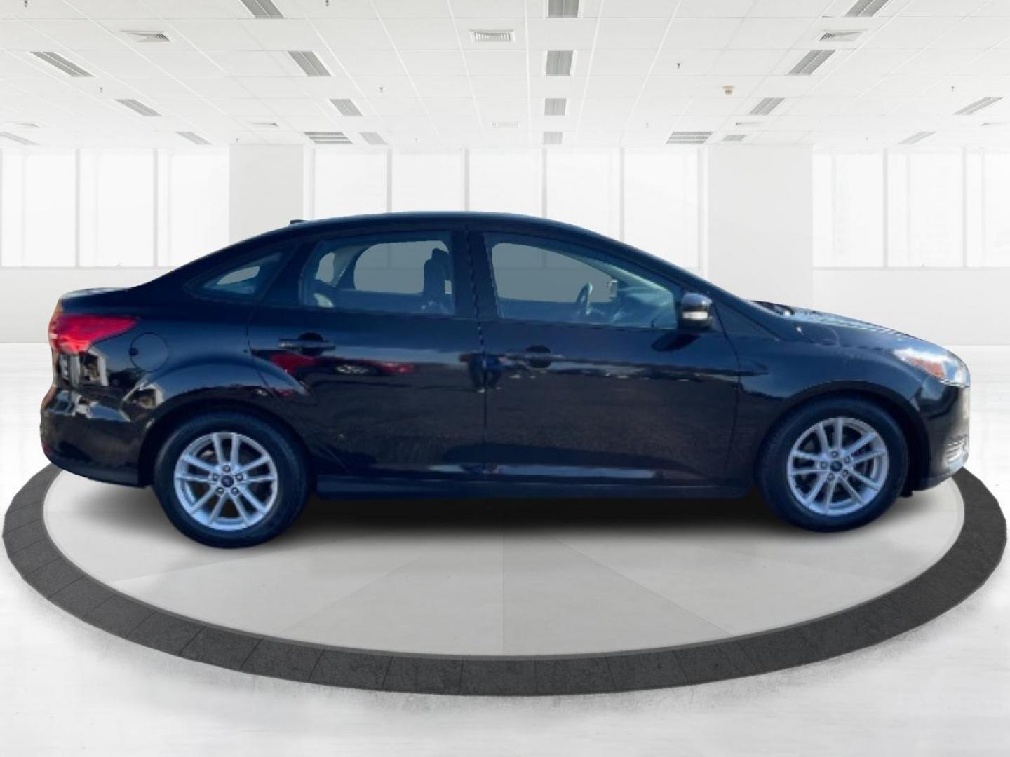 2017 Shadow Black Ford Focus SE Sedan (1FADP3F20HL) with an 2.0L L4 DOHC 16V engine, located at 1099 N County Rd 25A, OH, 45373, (937) 908-9800, 40.057079, -84.212883 - Photo#0