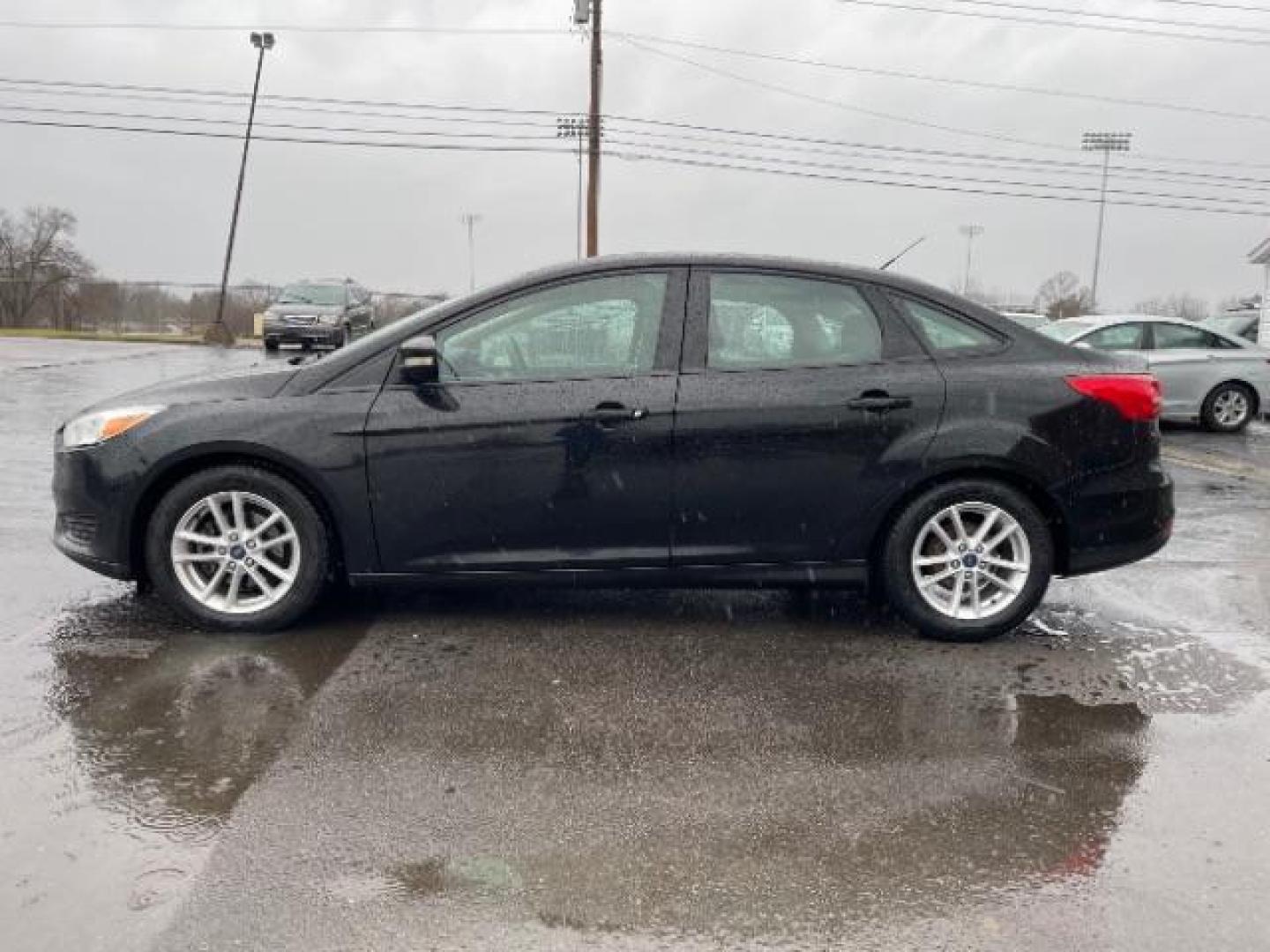 2017 Shadow Black Ford Focus SE Sedan (1FADP3F23HL) with an 2.0L L4 DOHC 16V engine, located at 1184 Kauffman Ave, Fairborn, OH, 45324, (937) 908-9800, 39.807365, -84.029114 - Photo#4