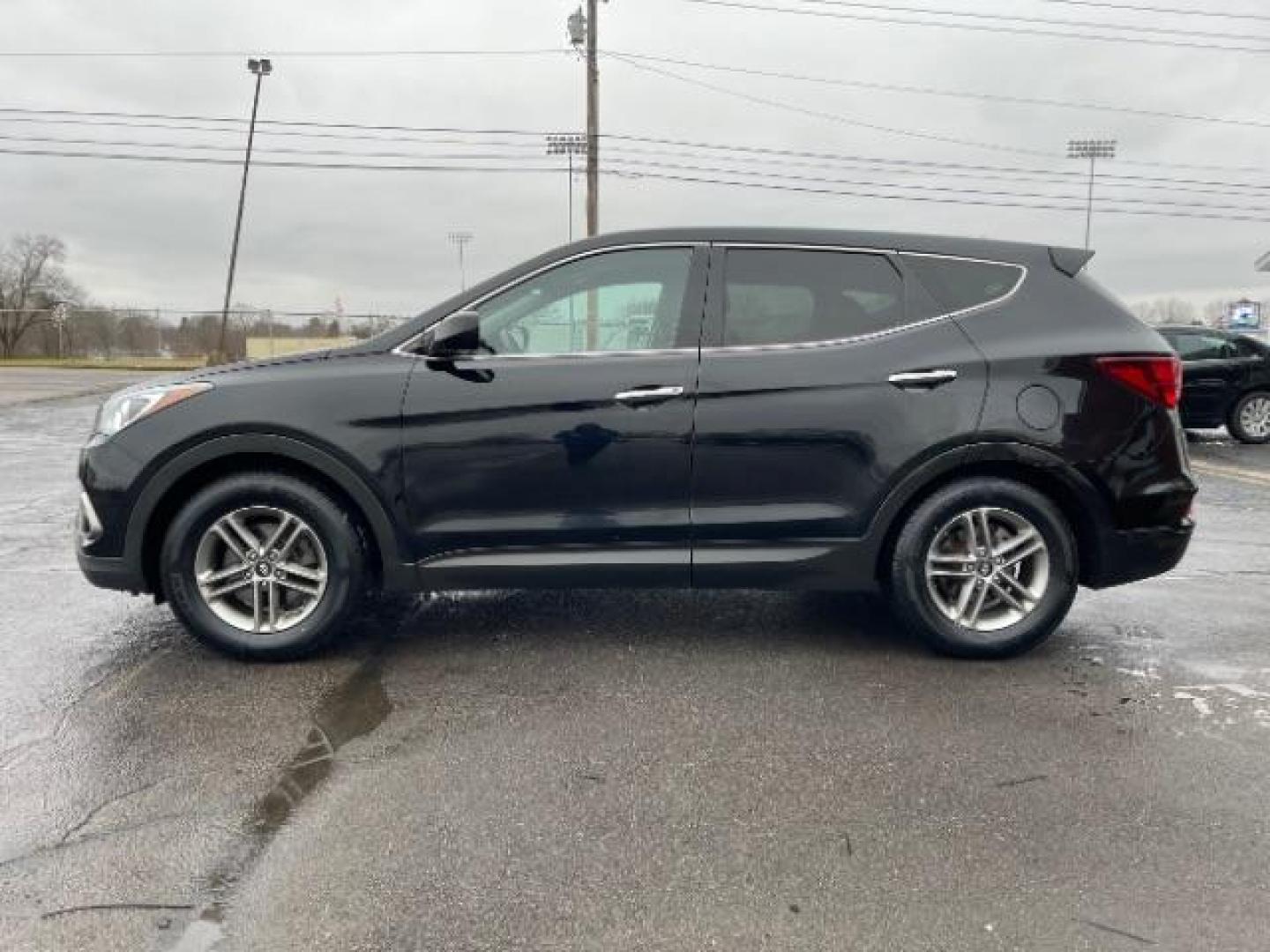 2017 Twilight Black Hyundai Santa Fe Sport 2.4 FWD (5XYZT3LBXHG) with an 2.4L L4 DOHC 16V engine, 6-Speed Automatic transmission, located at 1230 East Main St, Xenia, OH, 45385, (937) 908-9800, 39.687321, -83.910294 - Photo#2