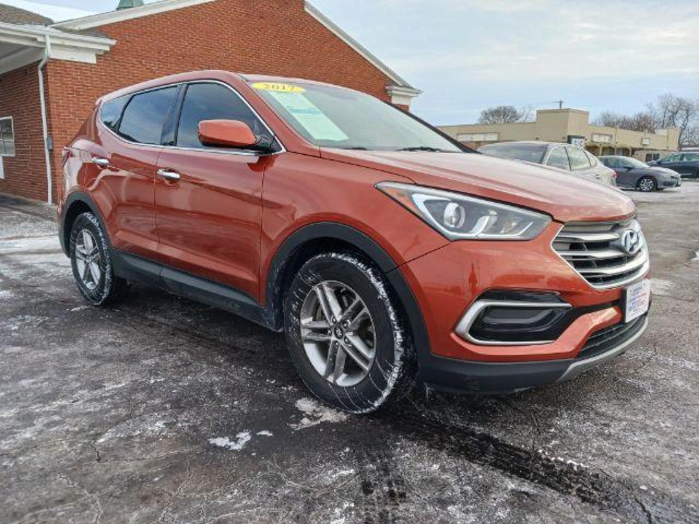 2017 Canyon Copper Hyundai Santa Fe Sport 2.4 AWD (5XYZTDLB2HG) with an 2.4L L4 DOHC 16V engine, 6-Speed Automatic transmission, located at 1951 S Dayton Lakeview Rd., New Carlisle, OH, 45344, (937) 908-9800, 39.890999, -84.050255 - Photo#0