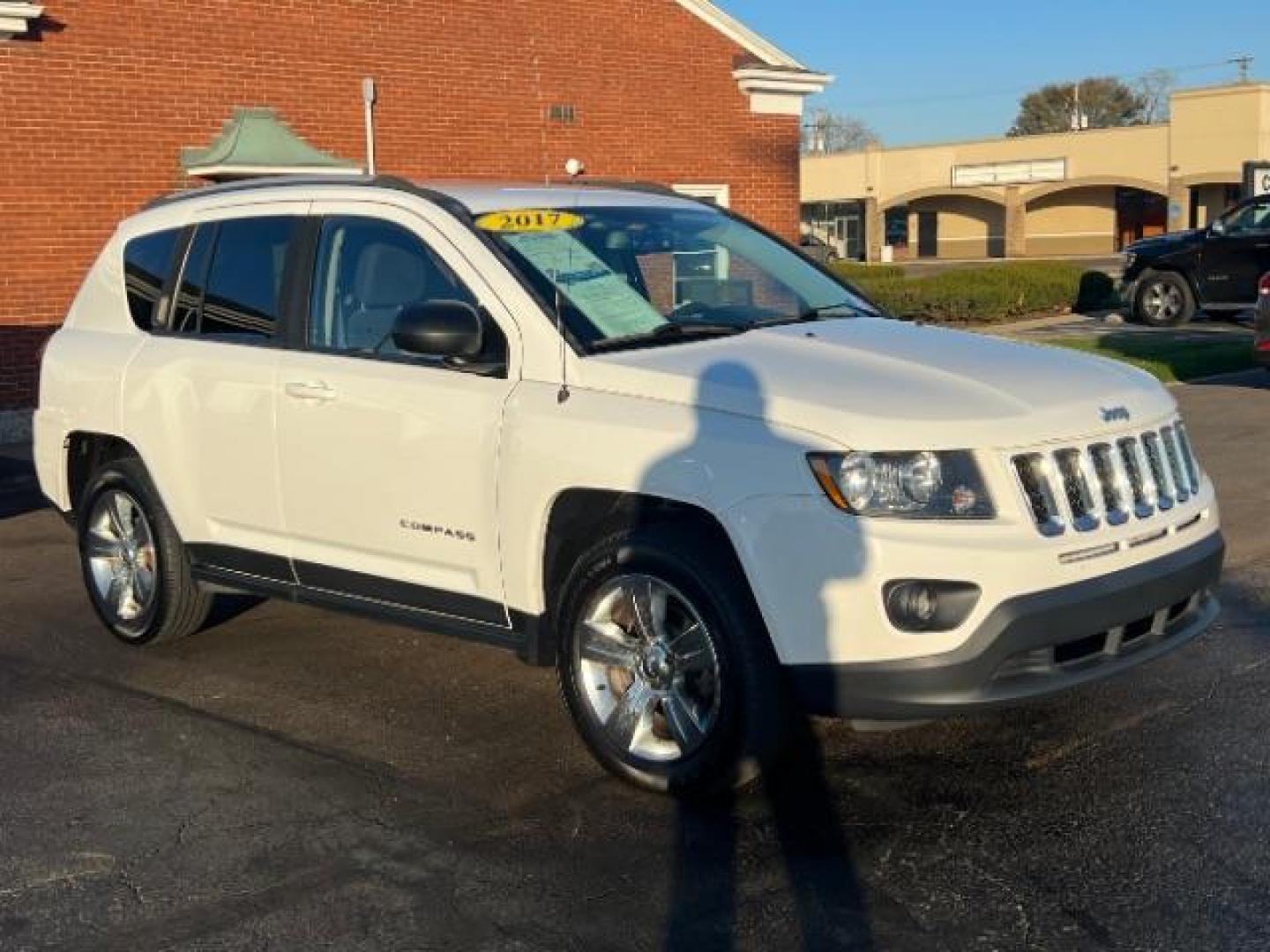 2017 White Knuckle Clear Coat Jeep Compass Sport FWD (1C4NJCBA3HD) with an 2.0L L4 DOHC 16V engine, located at 880 E. National Road, Vandalia, OH, 45377, (937) 908-9800, 39.892189, -84.181015 - Photo#0