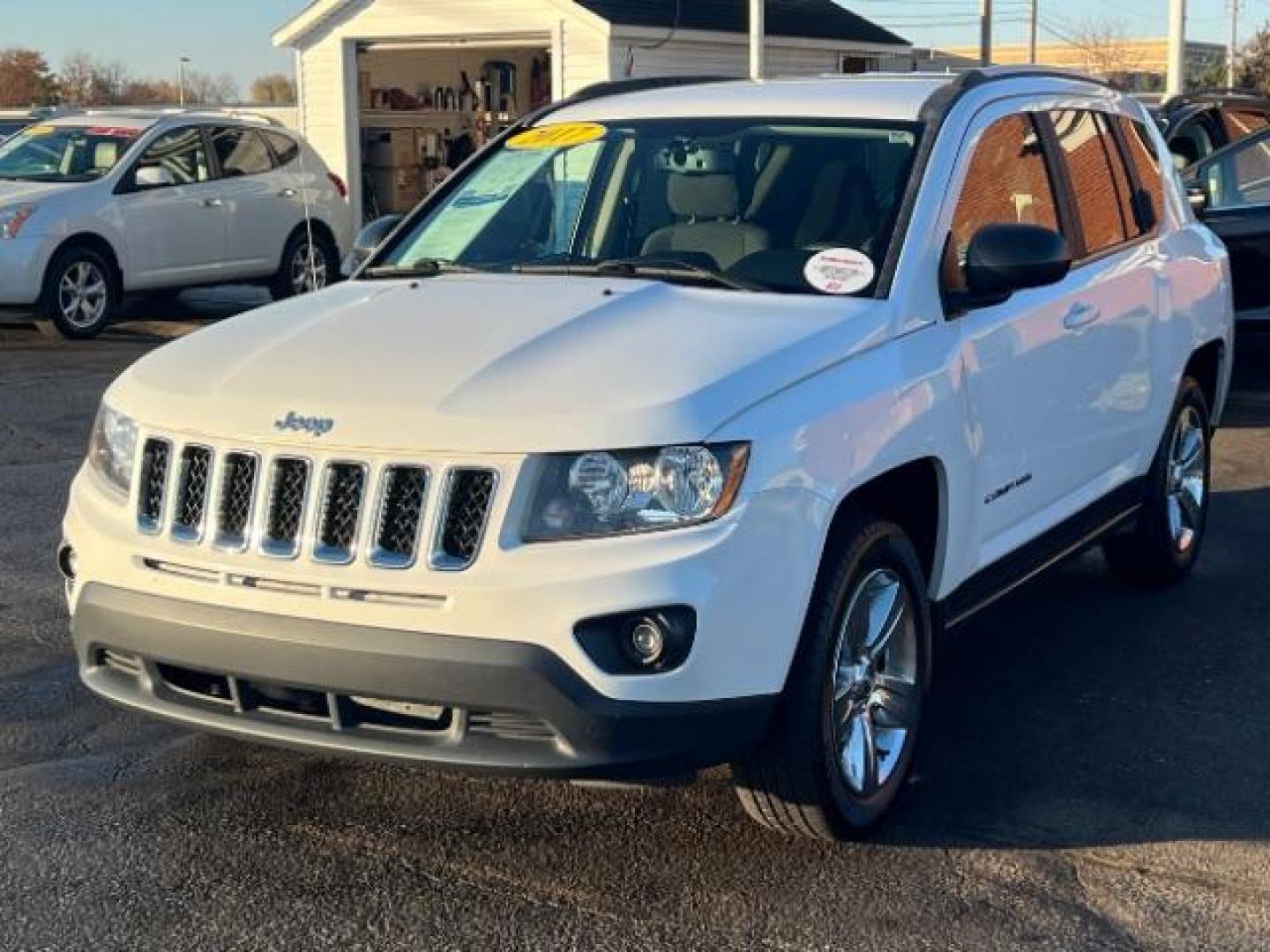 2017 White Knuckle Clear Coat Jeep Compass Sport FWD (1C4NJCBA3HD) with an 2.0L L4 DOHC 16V engine, located at 880 E. National Road, Vandalia, OH, 45377, (937) 908-9800, 39.892189, -84.181015 - Photo#2