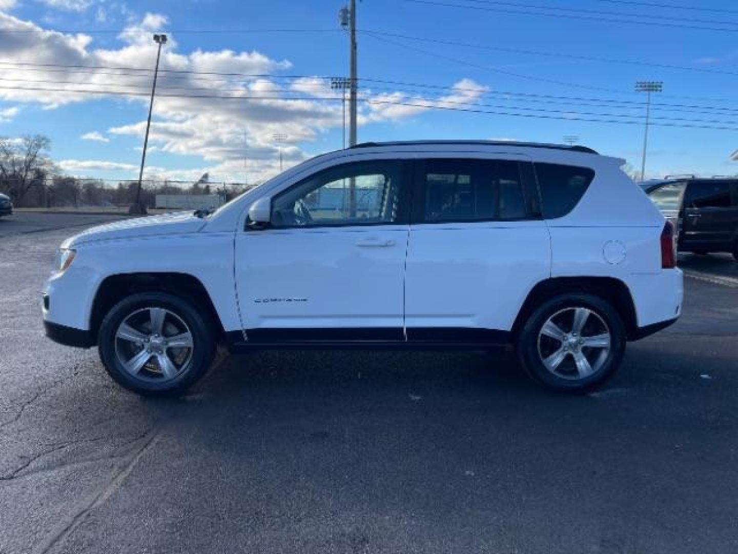 2017 White Knuckle Clear Coat Jeep Compass Latitude 4WD (1C4NJDEB8HD) with an 2.4L L4 DOHC 16V engine, 6-Speed Automatic transmission, located at 1951 S Dayton Lakeview Rd., New Carlisle, OH, 45344, (937) 908-9800, 39.890999, -84.050255 - Photo#2