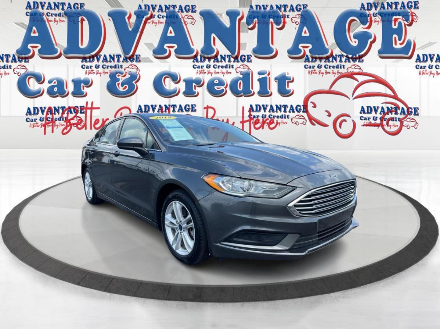 2018 Magnetic Metallic Ford Fusion SE (3FA6P0HD2JR) with an 1.5L L4 DOHC 16V engine, 6A transmission, located at 1951 S Dayton Lakeview Rd., New Carlisle, OH, 45344, (937) 908-9800, 39.890999, -84.050255 - Photo#0