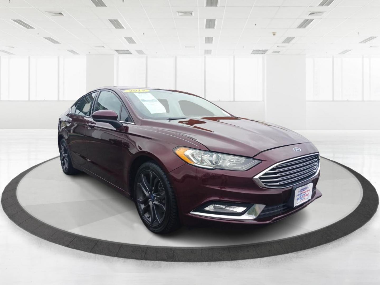 2018 Burgundy Velvet Metallic Tinted Clearcoat Ford Fusion SE (3FA6P0HD1JR) with an 1.5L L4 DOHC 16V engine, 6-Speed Automatic transmission, located at 1184 Kauffman Ave, Fairborn, OH, 45324, (937) 908-9800, 39.807365, -84.029114 - Photo#0