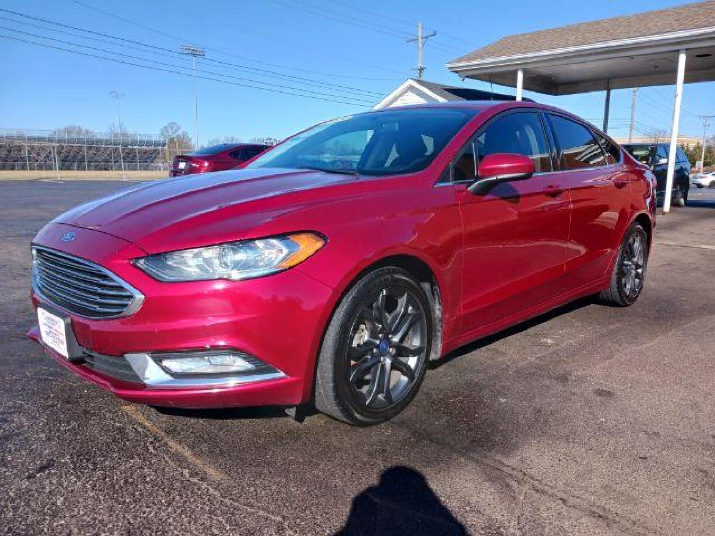 2018 Burgundy Velvet Metallic Tinted Clearcoat Ford Fusion SE (3FA6P0HDXJR) with an 1.5L L4 DOHC 16V engine, 6-Speed Automatic transmission, located at 1230 East Main St, Xenia, OH, 45385, (937) 908-9800, 39.687321, -83.910294 - Photo#2