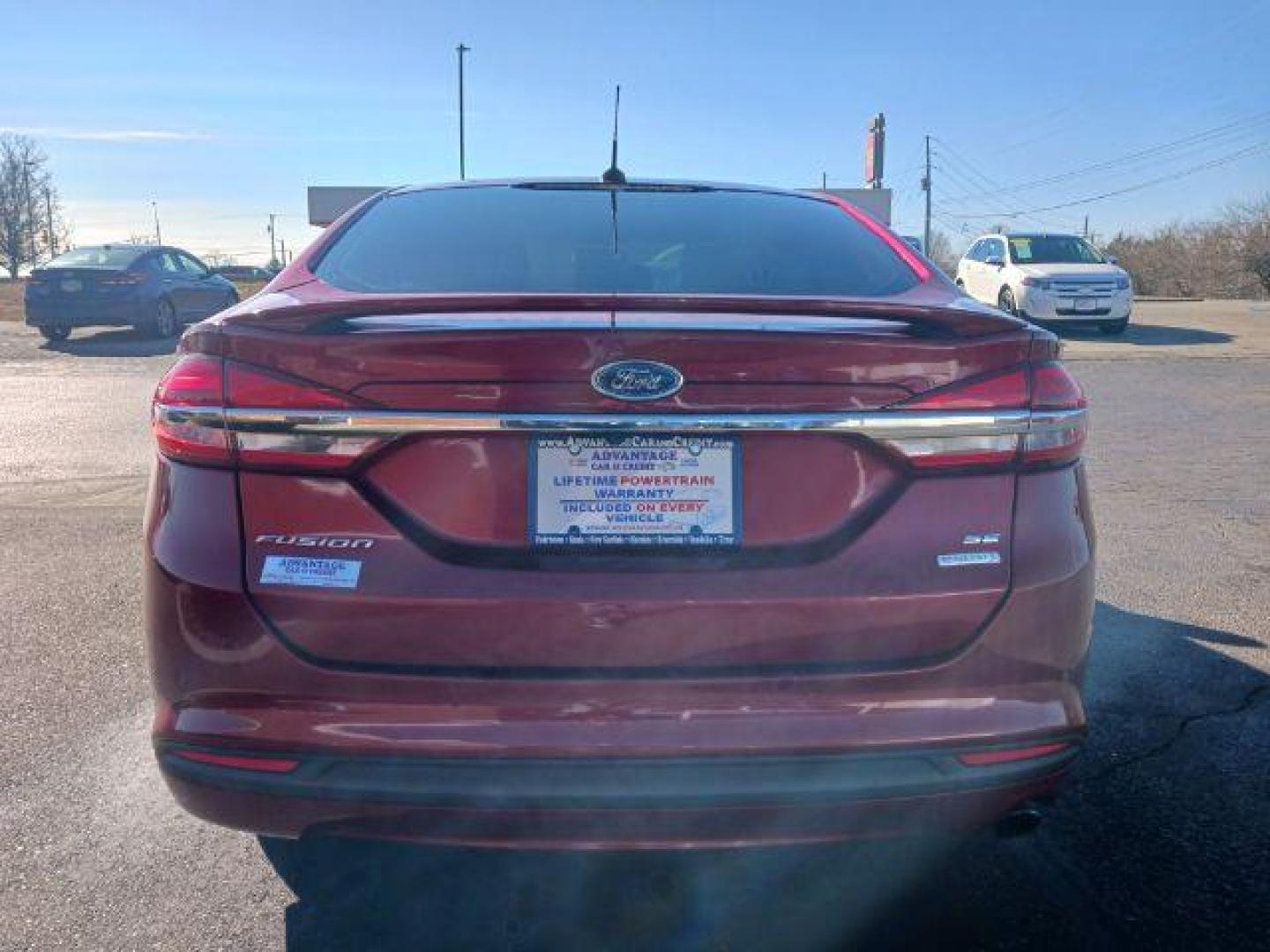 2018 Burgundy Velvet Metallic Tinted Clearcoat Ford Fusion SE (3FA6P0HDXJR) with an 1.5L L4 DOHC 16V engine, 6-Speed Automatic transmission, located at 1230 East Main St, Xenia, OH, 45385, (937) 908-9800, 39.687321, -83.910294 - Photo#5