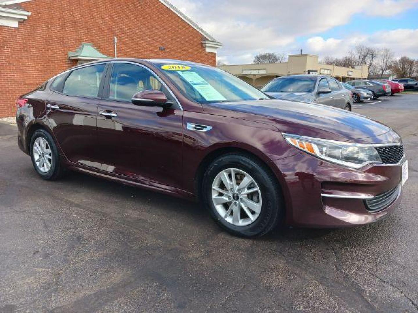 2018 Sangria Kia Optima LX (5XXGT4L34JG) with an 2.4L L4 DOHC 16V engine, 6-Speed Automatic transmission, located at 880 E. National Road, Vandalia, OH, 45377, (937) 908-9800, 39.892189, -84.181015 - Photo#0