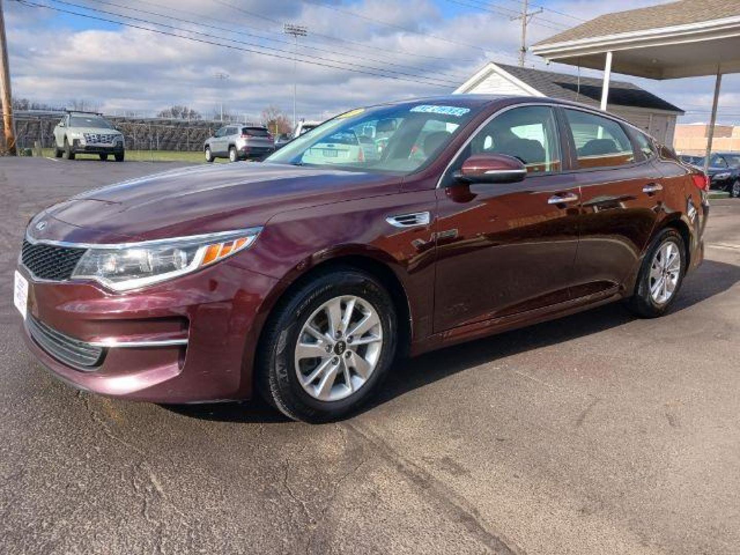 2018 Sangria Kia Optima LX (5XXGT4L34JG) with an 2.4L L4 DOHC 16V engine, 6-Speed Automatic transmission, located at 880 E. National Road, Vandalia, OH, 45377, (937) 908-9800, 39.892189, -84.181015 - Photo#2