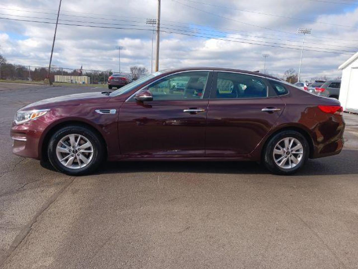 2018 Sangria Kia Optima LX (5XXGT4L34JG) with an 2.4L L4 DOHC 16V engine, 6-Speed Automatic transmission, located at 880 E. National Road, Vandalia, OH, 45377, (937) 908-9800, 39.892189, -84.181015 - Photo#3