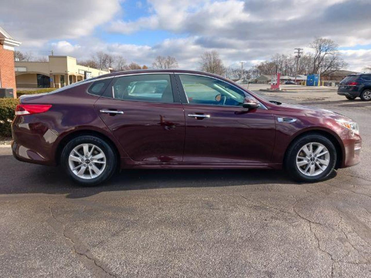 2018 Sangria Kia Optima LX (5XXGT4L34JG) with an 2.4L L4 DOHC 16V engine, 6-Speed Automatic transmission, located at 880 E. National Road, Vandalia, OH, 45377, (937) 908-9800, 39.892189, -84.181015 - Photo#4