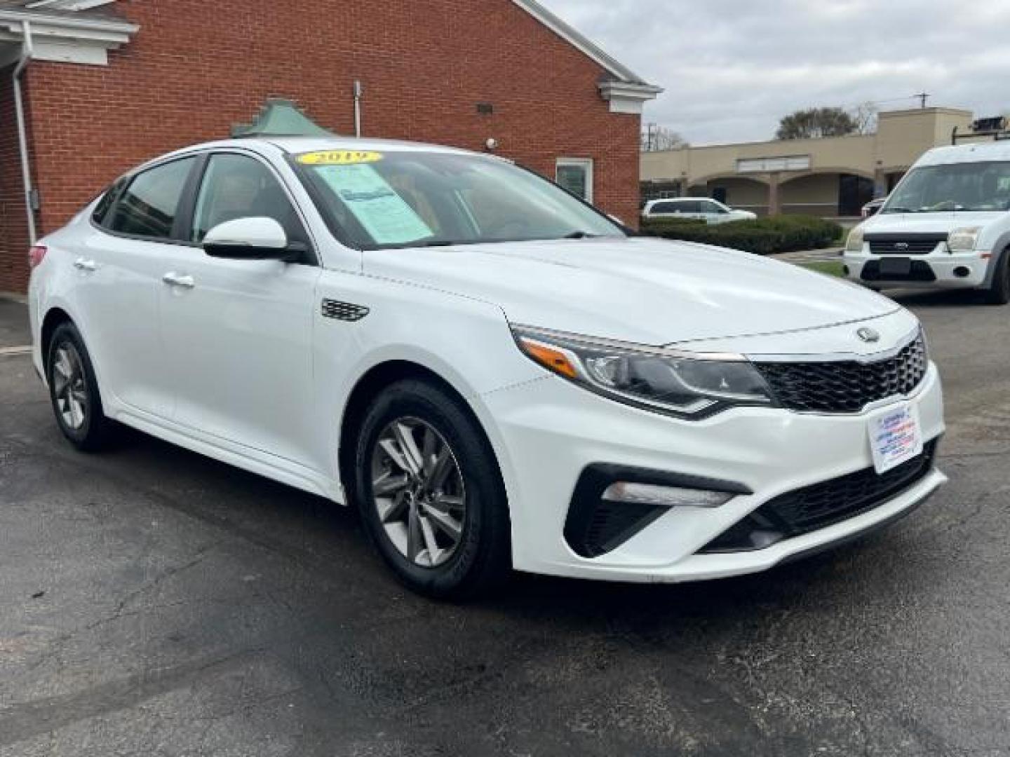 2019 Snow White Pearl Kia Optima LX (5XXGT4L30KG) with an 2.4L L4 DOHC 16V engine, 6-Speed Automatic transmission, located at 4508 South Dixie Dr, Moraine, OH, 45439, (937) 908-9800, 39.690136, -84.216438 - Photo#0